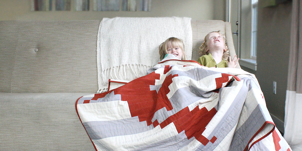 silly girls in a cozy quilt